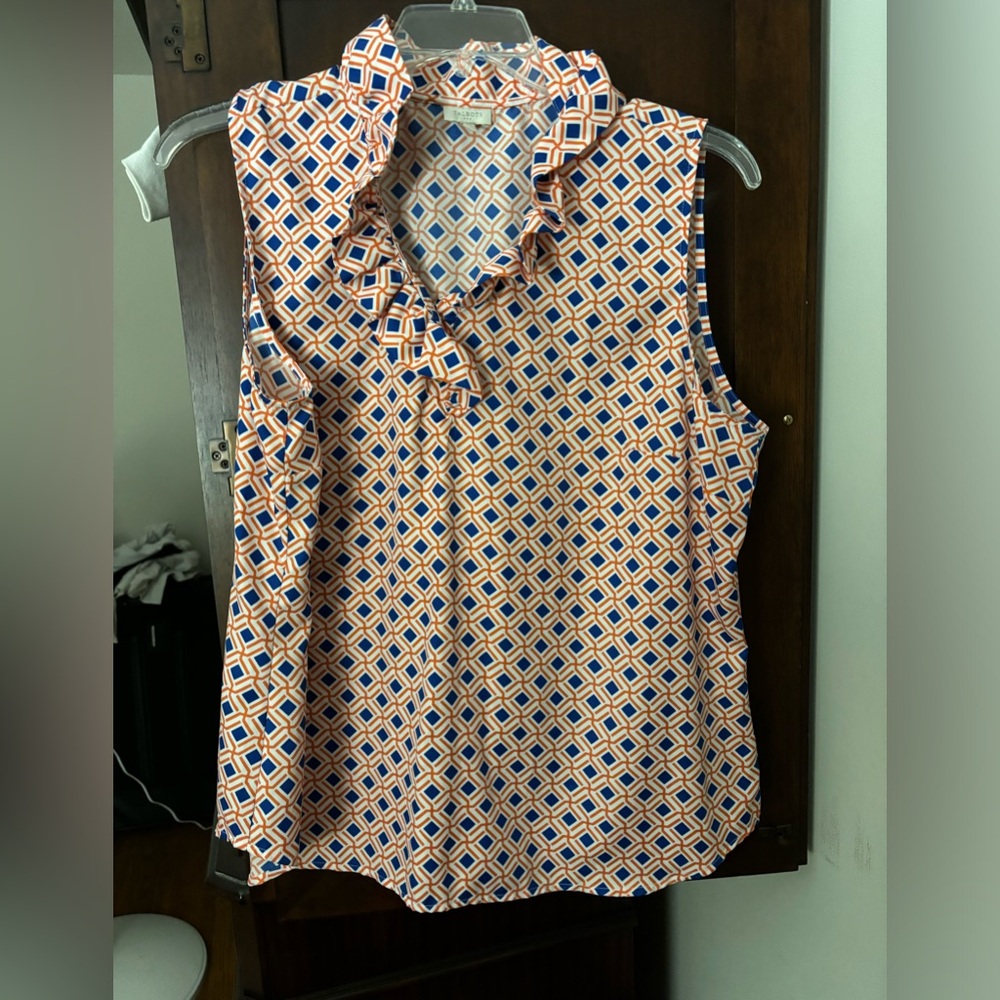Sweet little blouse with ruffled neck. Stand-up collar.